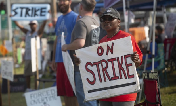 Kym Lewis, a Frito-Lay employee, stands on the strike line Thursday, July 22, 2021 outside of the Topeka plant. Workers said the main points of contention are small pay increases and employees being forced to work hours of overtime. (Evert Nelson /The Topeka Capital-Journal via AP)
