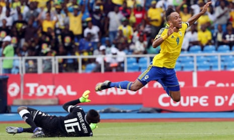 Gabon’s Pierre-Emerick Aubameyang is tripped by Burkina Faso’s goalkeeper Herve Koffi