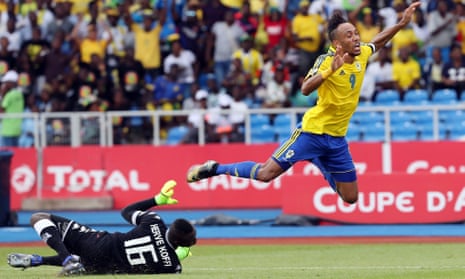 Pierre-Emerick Aubameyang of Gabon is fouled by Herve Koffi of Burkina Faso, before getting up to score from the spot.