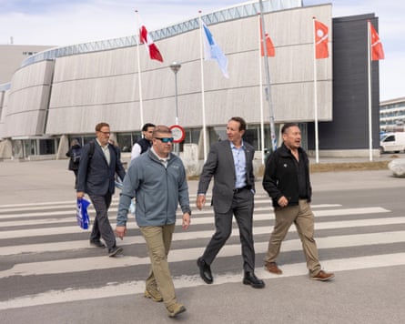 Jeff Landry and others cross a road