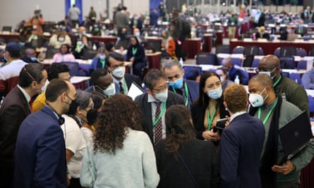 People wearing face masks in a conference hall