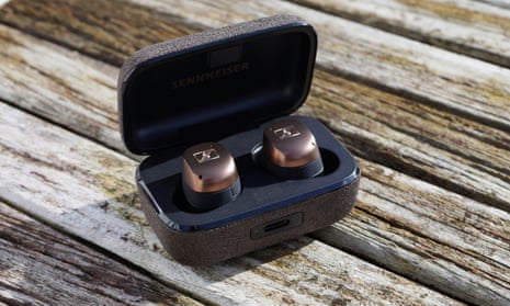 Sennheiser Momentum TW4 earbuds in case on a table.