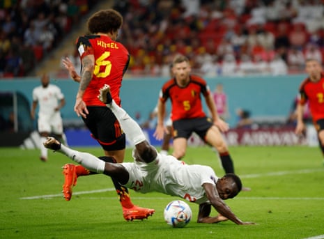 Canada's Richie Laryea goes to ground after a challenge from Belgium’s Axel Witsel.