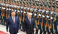 Vladimir Putin and Xi Jinping review a guard of honour in Beijing on 16 May.