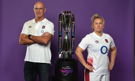 England head coach, John Mitchell, poses with England captain, Marlie Packer, and the Women’s Six Nations trophy