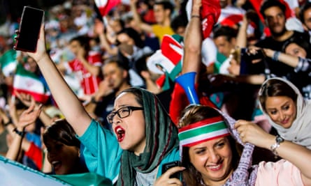 Fans cheer during a screening of the World Cup Group match between Iran and Spain in Tehran’s Azadi stadium in June.