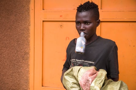 A child who lives on the streets in Kisenyi inhales aviation fuel.