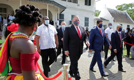 Mike Pompeo with Suriname’s president Chan Santokhi in Paramaribo. Pompeo said: ‘No state-owned operation can beat the quality of American private companies.’