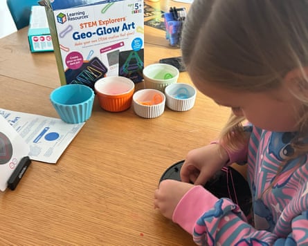 Girl plays with the Geo-Glow art kit