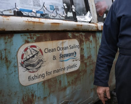An old sticker on a very rusty van.
