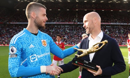 David de Gea is presented with the Premier League Golden Glove trophy by Erik ten Hag in May.