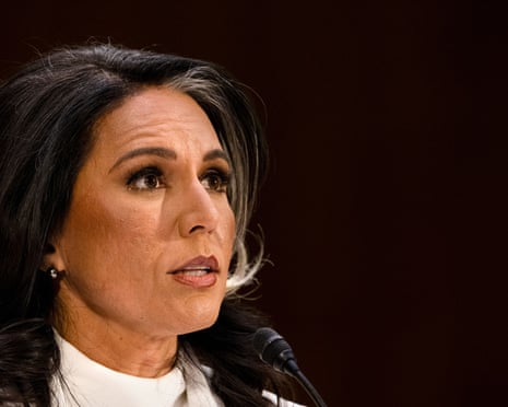 Woman looks ahead and speaks into microphone