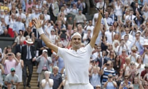 Roger Federer turns to his coaches and family in celebration after serving an ace on match point.