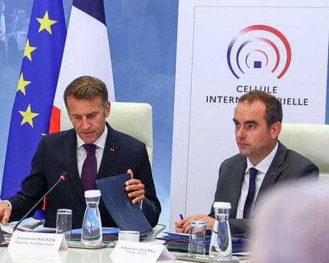 France's president Emmanuel Macron and France's prime minister Sébastien Lecornu attend a meeting with members of the cabinet to discuss wildfires in the country, at the Hotel de Beauvau, headquarters of the Interior Ministry, in Paris, France.