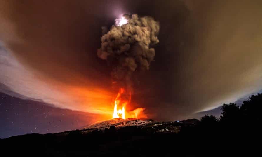Lightning highlights the ash as it spews out Mount Etna’s Vorgaine crater.