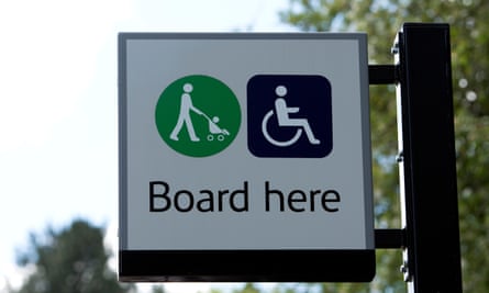 Pushchair and wheelchair boarding sign at a railway station