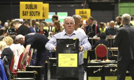 A man carries a ballot box during the Irish referendum on repealing the eighth amendment