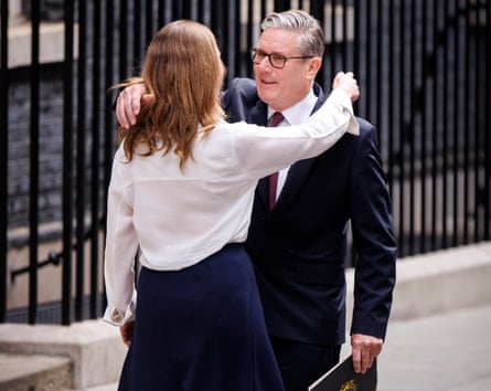 Keir Starmer embraces his wife, Victoria, after making his resignation statement in Downing Street, London, on Monday.