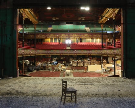 A view of the stage of the hippodrome, and a bare floor with a chair on it