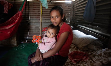 Sumina Pariyar, now aged 17, and her baby Unika, aged eight months, at their home in Jadibuti, Kathmandu district.