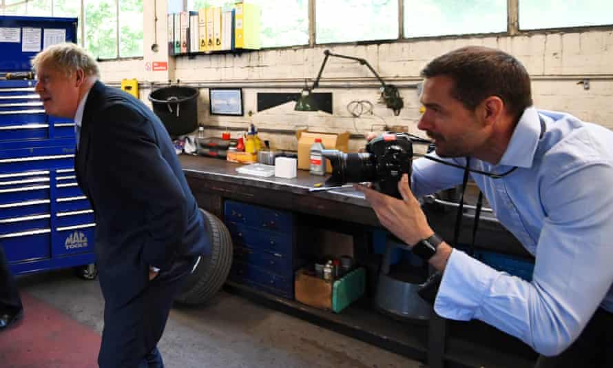 Andrew Parsons takes a picture of Boris Johnson at an official event.