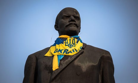 A statue of Lenin dressed with a Ukrainian flag in the east of the country