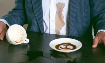 Man spilled coffee or tea on a white shirt