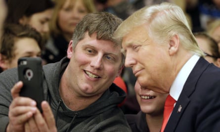 Donald Trump poses for a photo with a fan in Minnesota