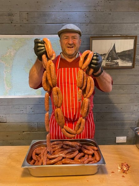 Rona caretaker Bill Cowie with a batch of homemade venison sausages