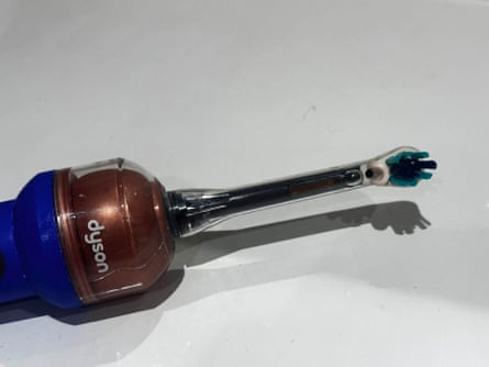 Closeup image of the brush head and camera hole on the Dyson CameraJet toothbrush.