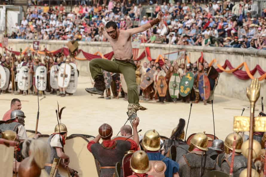 Fight club … gladiators tussle with a solo attacker during the Great Roman Games in Nimes, France.