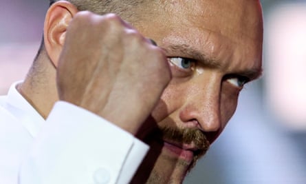 Closeup of boxer Oleksandr Usyk pictured in profile with his fist in front of his face