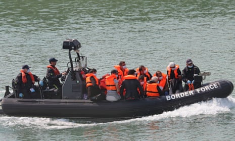 People in orange life vests aboard a Border Force boat