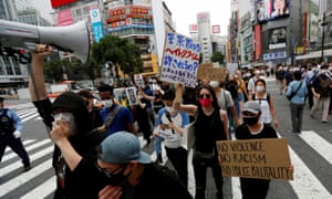 Protesters march over alleged police abuse of a Kurdish man in Tokyo and in solidarity with the Black Lives Matter movement.