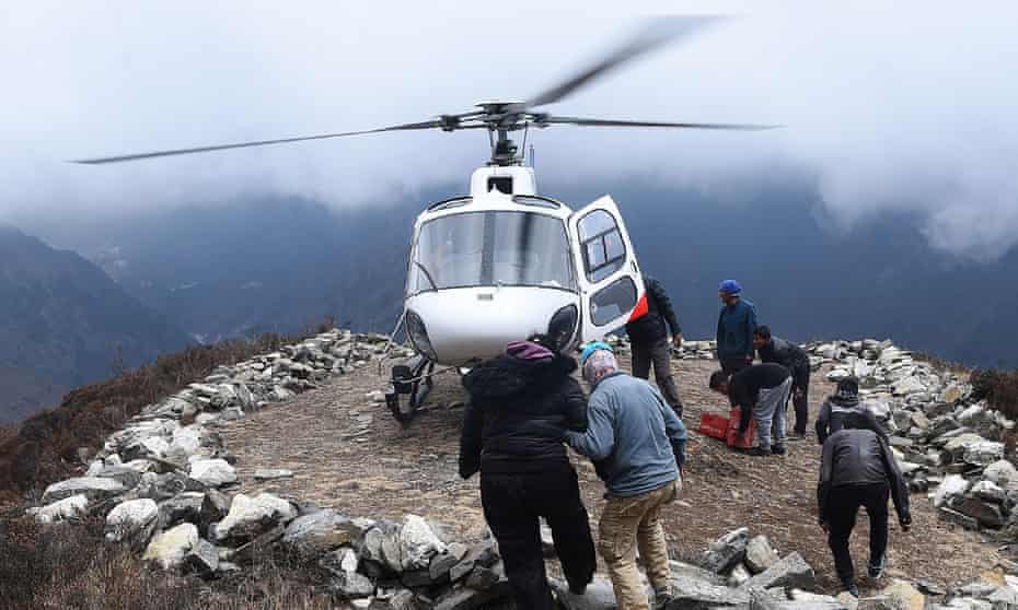 A rescue helicopter picks up a patient on the route to  Everest base camp