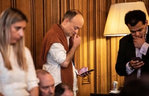 Dominic Cummings listens to Boris Johnson during the news conference on 16 March.