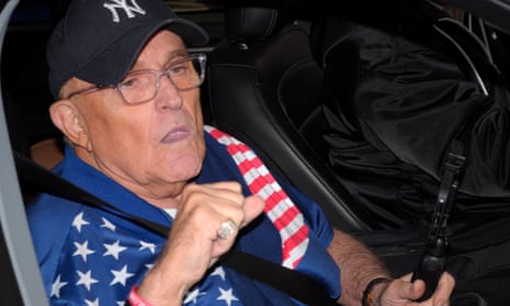 man in a baseball cap and an american flag-patterned top