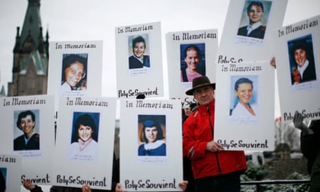 Demonstrators hold portraits during a rally to commemorate the Montreal mass shooting of 14 female engineering students in 1989. 