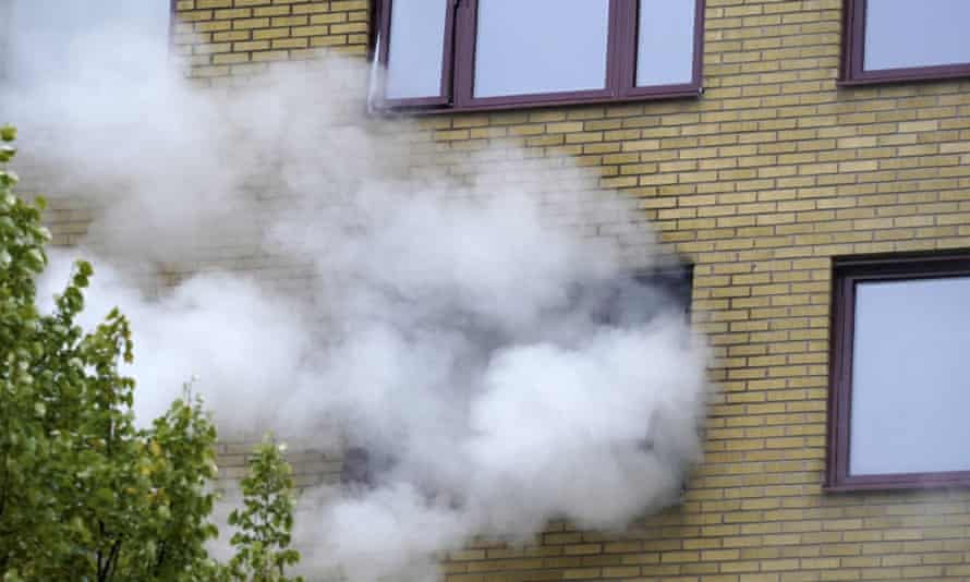 Smoke billows from an apartment building after an explosion in Annedal, central Gothenburg