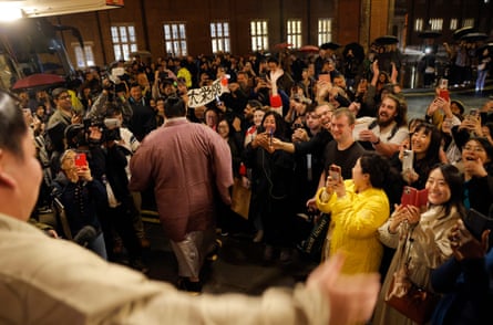 Fans greet the rikishi as they leave the stage door of the Royal Albert Hall