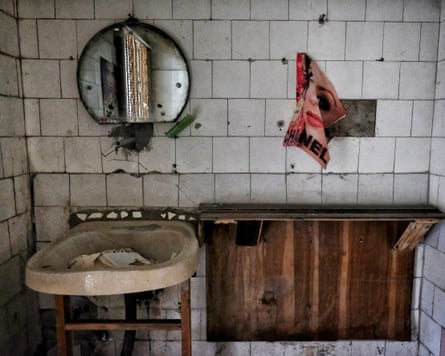 Decrepit tiled bathroom