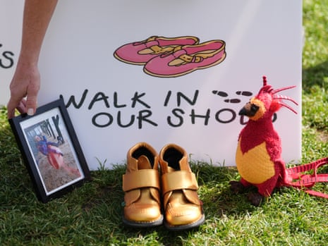 The mother of Finn Clancy – who died aged 10 in 2018 – places a photo of him, a pair of his shoes, and a stuffed toy in Parliament Square.