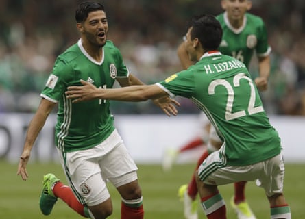 Carlos Vela celebrates with Hirving Lozano after scoring for Mexico against USA in a World Cup qualifier at the Estadio Azteca.