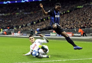 Inter's Kwadwo Asamoah, right, is challenged by Tottenham's Erik Lamela.