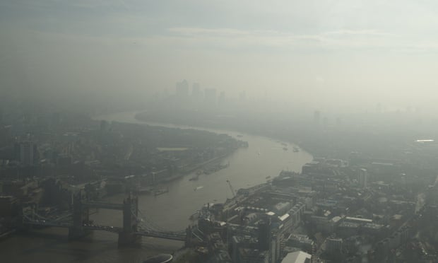 A view of London over Tower Bridge, lower left, the river Thames and east towards Canary Wharf, top, which is just visible through haze and smog last April. 