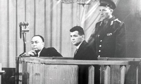 Francis Gary Powers, centre, sits accused in Moscow’s Hall of Columns, during the opening of his espionage trial, 17 August 1960.
