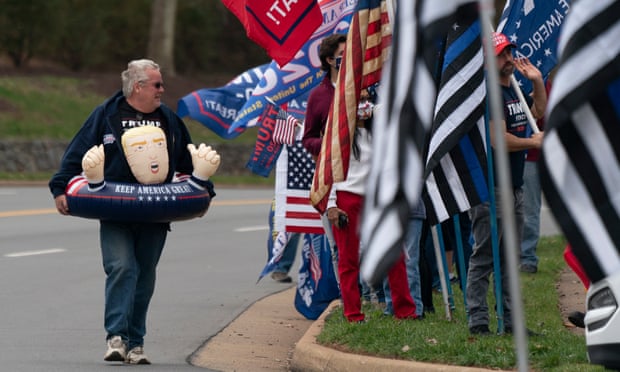 Raymond Deskins wears an inflatable toy supporting Donald Trump at a protest outside Trump National Golf Club, in Sterling, Virginia, on Saturday.