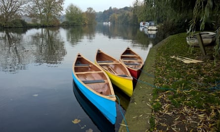 The canoes are handcrafted by Nick and have bright, primary colour paint jobs