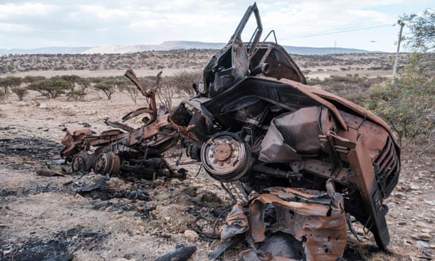 A destroyed military vehicle lies at the roadside north of Mekele, the capital of Tigray