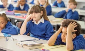 School children listen in to a lesson in class.